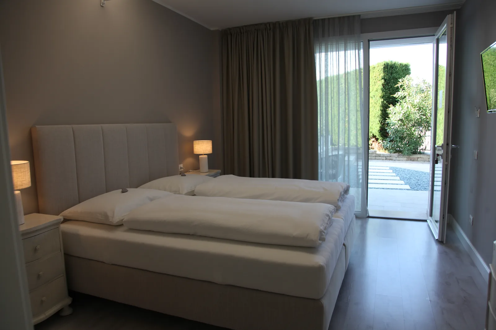 Orchidea double room at Harmony Affi with twin beds and a garden entrance